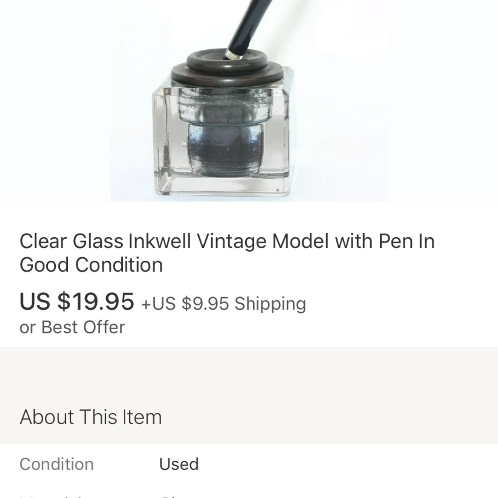 Vintage quill pen with bottle in glass